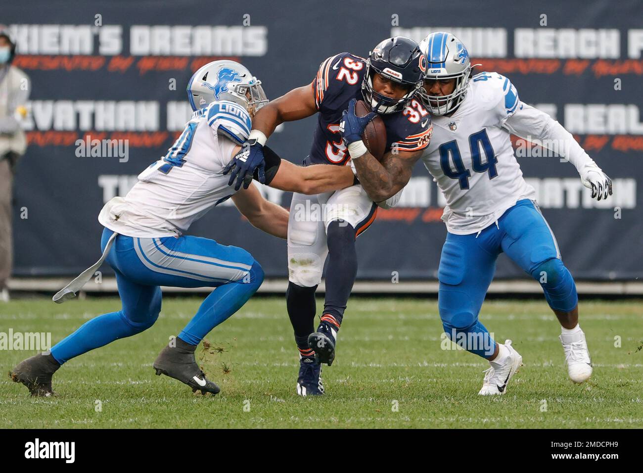 Chicago Bears running back David Montgomery (32) is tackled by Detroit  Lions linebacker Jalen Reeves-Maybin (44) during the second half of an NFL  football game, Sunday, Oct. 3, 2021, in Chicago. (AP