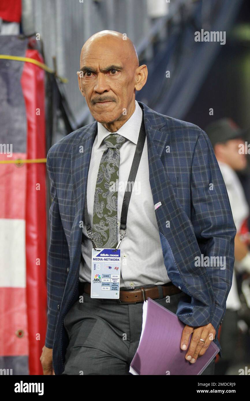 NBC Sports Football Night in America commentator Tony Dungy walks onto the  field prior to an NFL football game between the New England Patriots and  the Tampa Bay Buccaneers, Sunday, Oct. 3,