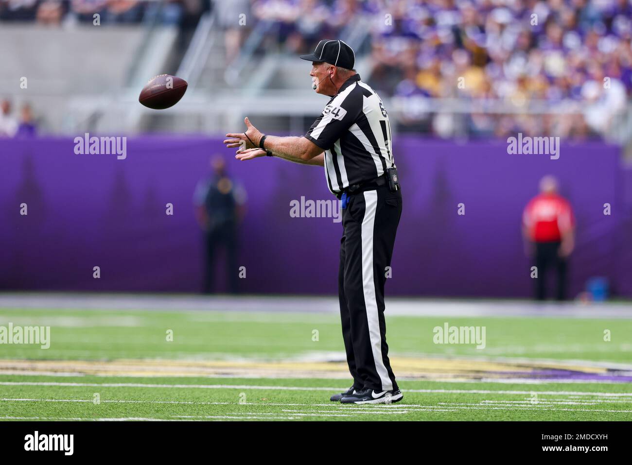 NFL umpire Dan Ferrell (64) on the field during an NFL football game  between the Cleveland Browns and Minnesota Vikings, Sunday, Oct. 3, 2021 in  Minneapolis. Cleveland won 14-7. (AP Photo/Stacy Bengs