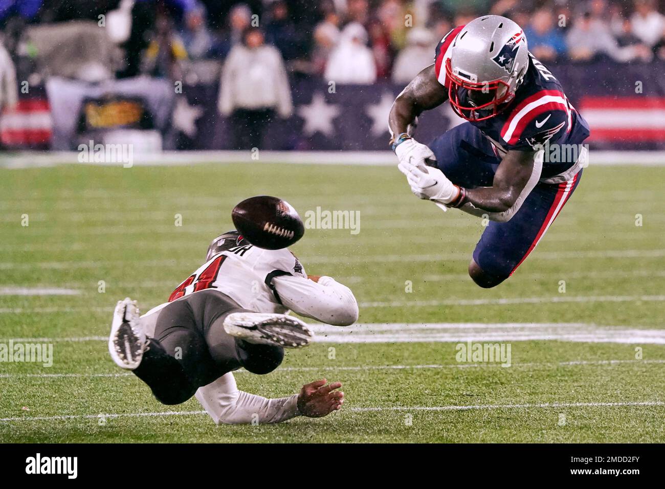 Tampa Bay Buccaneers safety Antoine Winfield Jr., left, knocks the