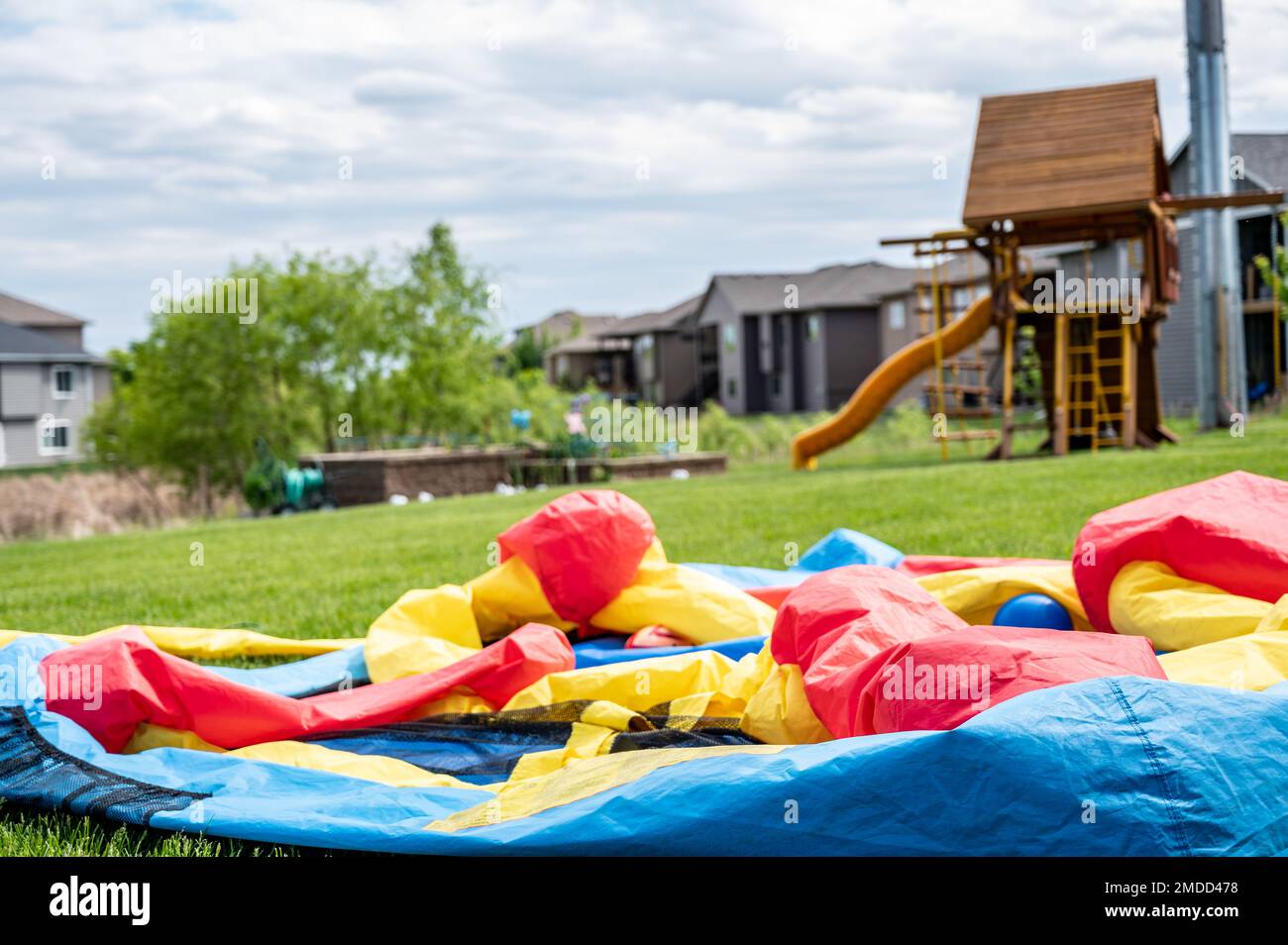 Deflated bouncy house in backyard Stock Photo Alamy