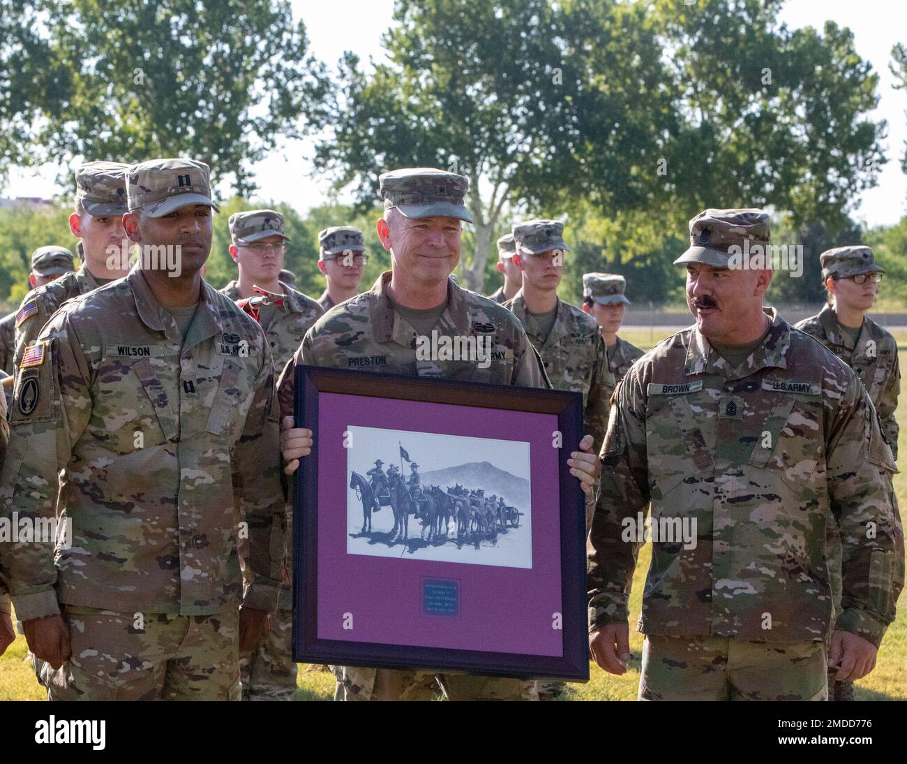 Brig. Gen. Andrew Preston, field artillery commandant, Field Artillery School, center, presents the Hamilton Award to Capt. Zebadiah Wilson, Bravo Battery, 1st Battalion, 158th Field Artillery Regiment commander, right. The Alexander Hamilton Award is presented annually to the best field artillery unit in the National Guard. Stock Photo