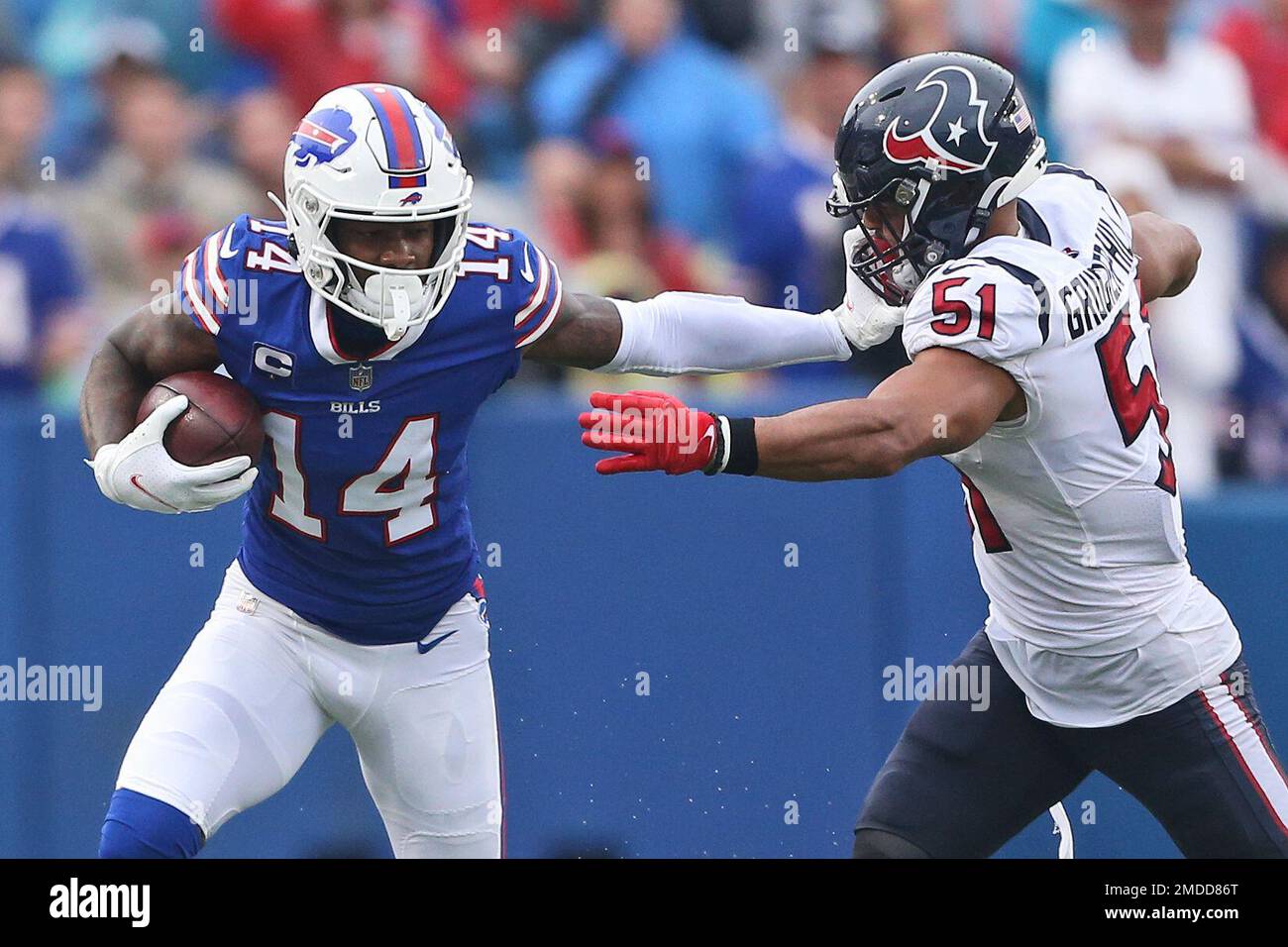 Buffalo Bills wide receiver Stefon Diggs (14) stiff arms Houston Texans
