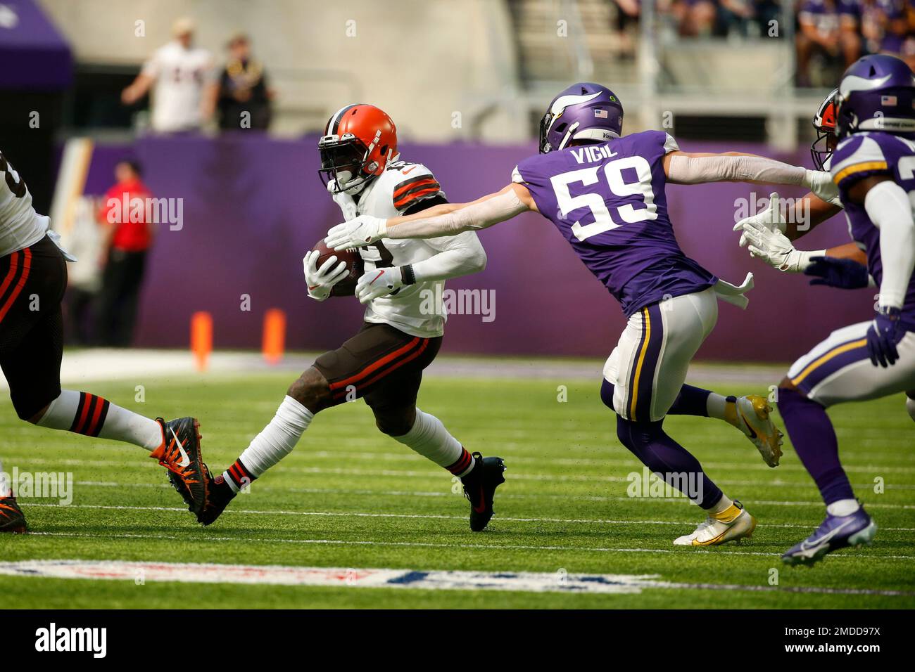 Cleveland Browns wide receiver Odell Beckham Jr. (13) runs from Minnesota  Vikings outside linebacker Nick Vigil (59) after catching a pass during the  first half of an NFL football game, Sunday, Oct.