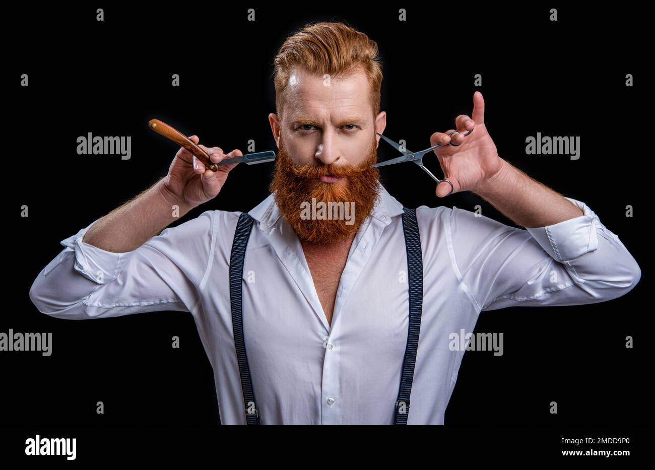 face of barber man in studio. barber man with scissors and retro razor ...