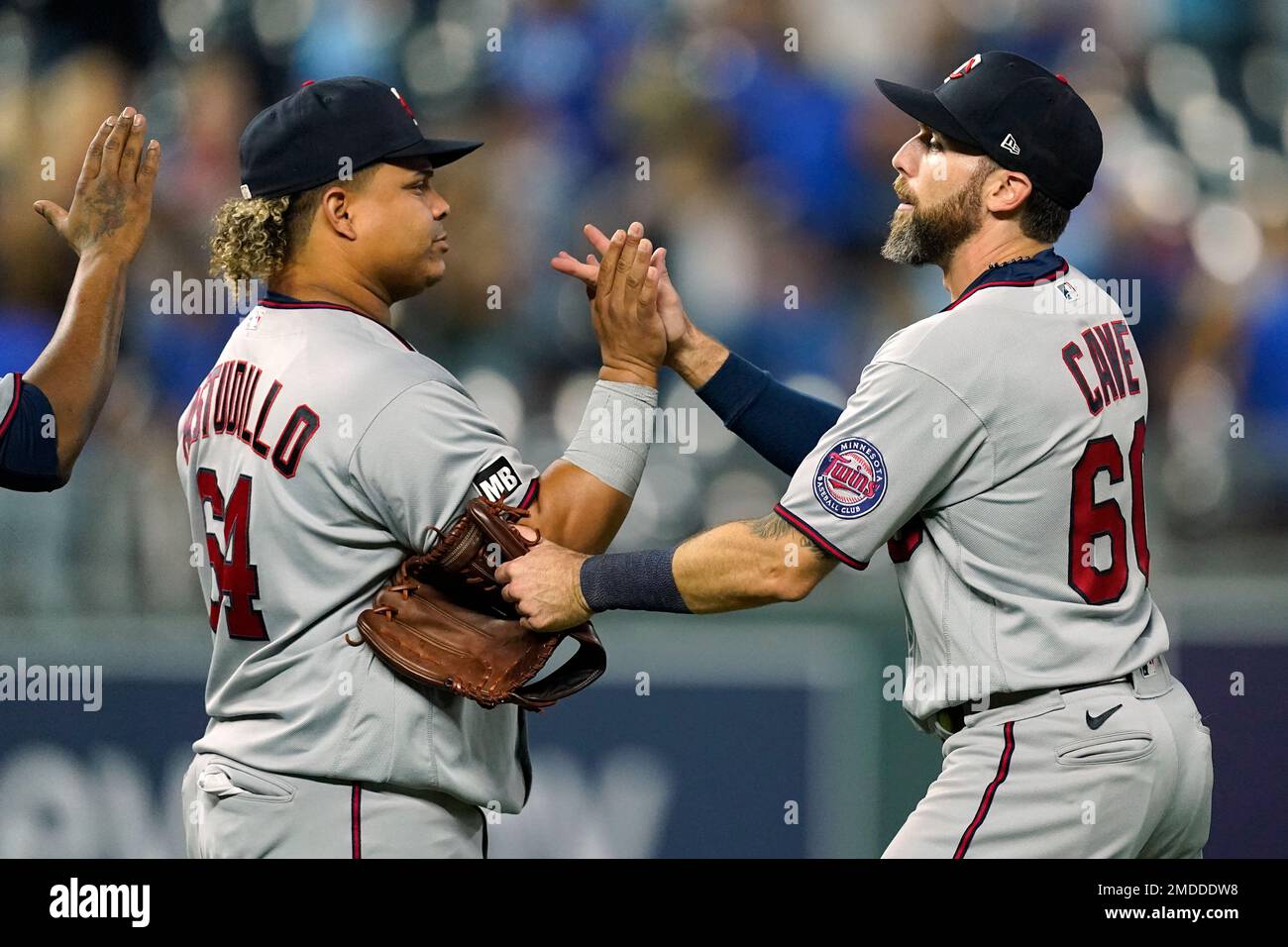Minnesota Twins' Willians Astudillo, left, and Jake Cave celebrate after  their baseball game against the Kansas