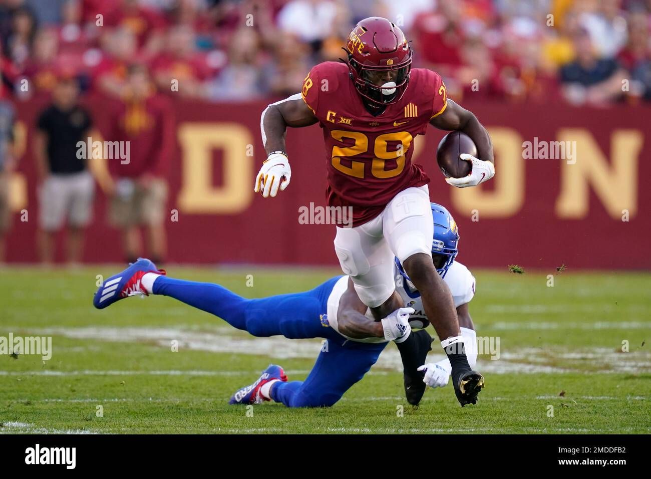 Iowa State running back Breece Hall (28) breaks a tackle by Kansas ...