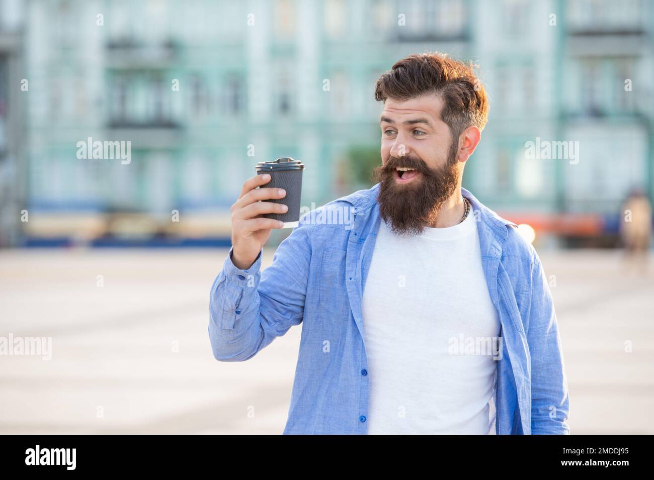 Guy Offering surprised guy offering coffee outdoor. guy offering coffee outside. guy ...