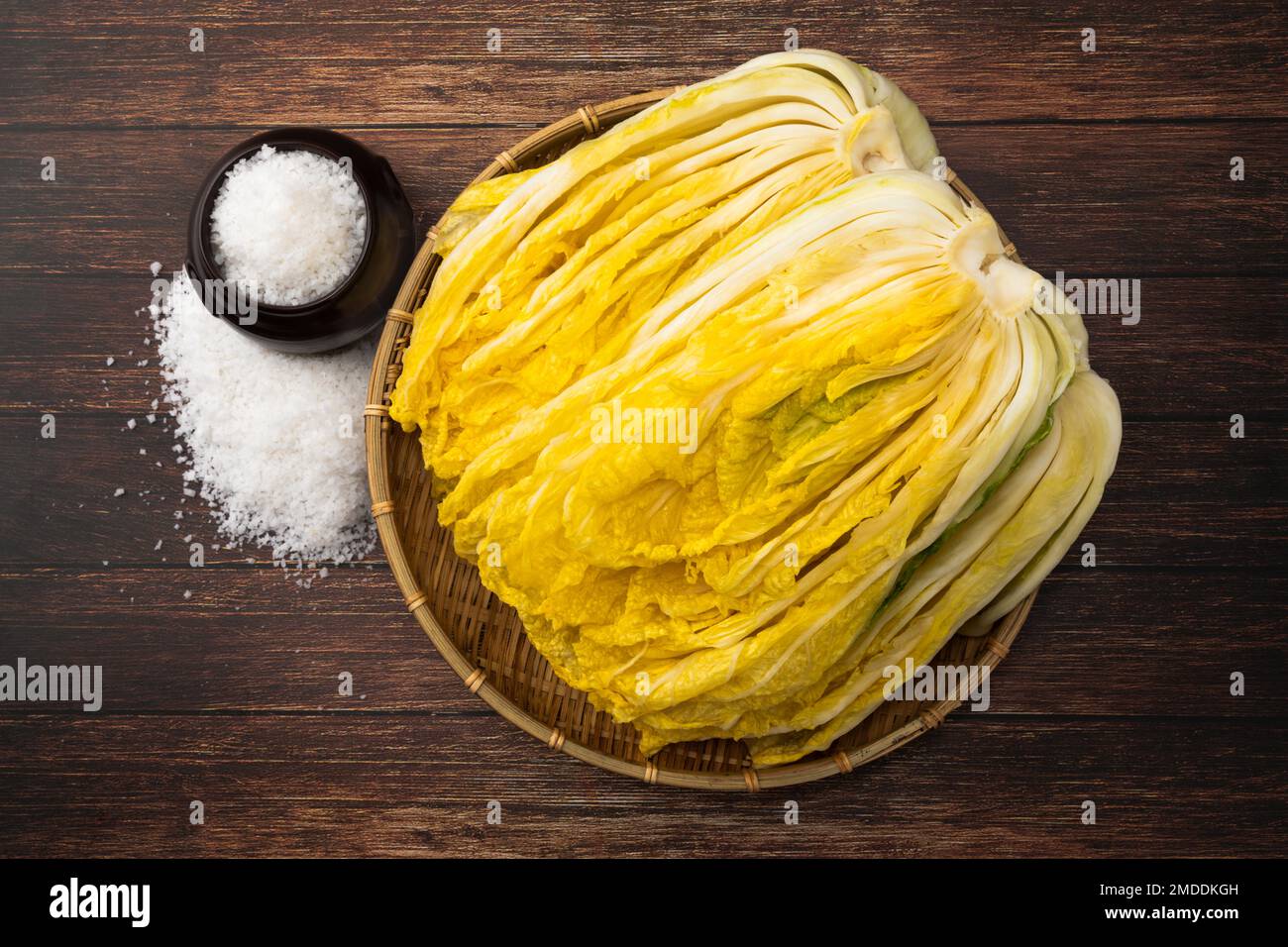 Kimchi Cabbage. Korean traditional way, salted cabbage. Wood deck background, closeup viewed from above. Stock Photo