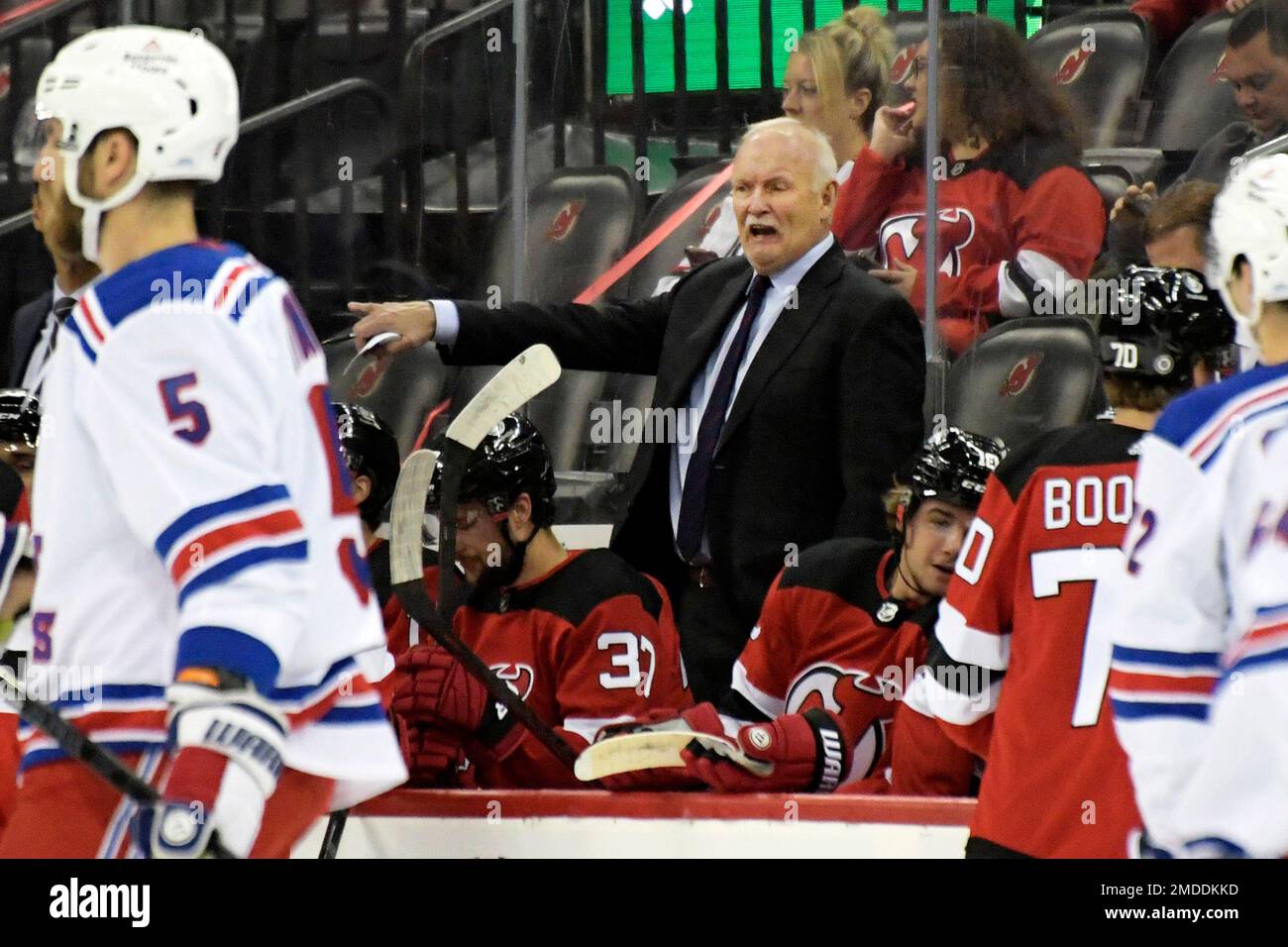 New Jersey Devils head coach Lindy Ruff looks on against the Edmonton Oilers  during the first period of an NHL hockey game Monday, Nov. 21, 2022, in  Newark, N.J. (AP Photo/Adam Hunger