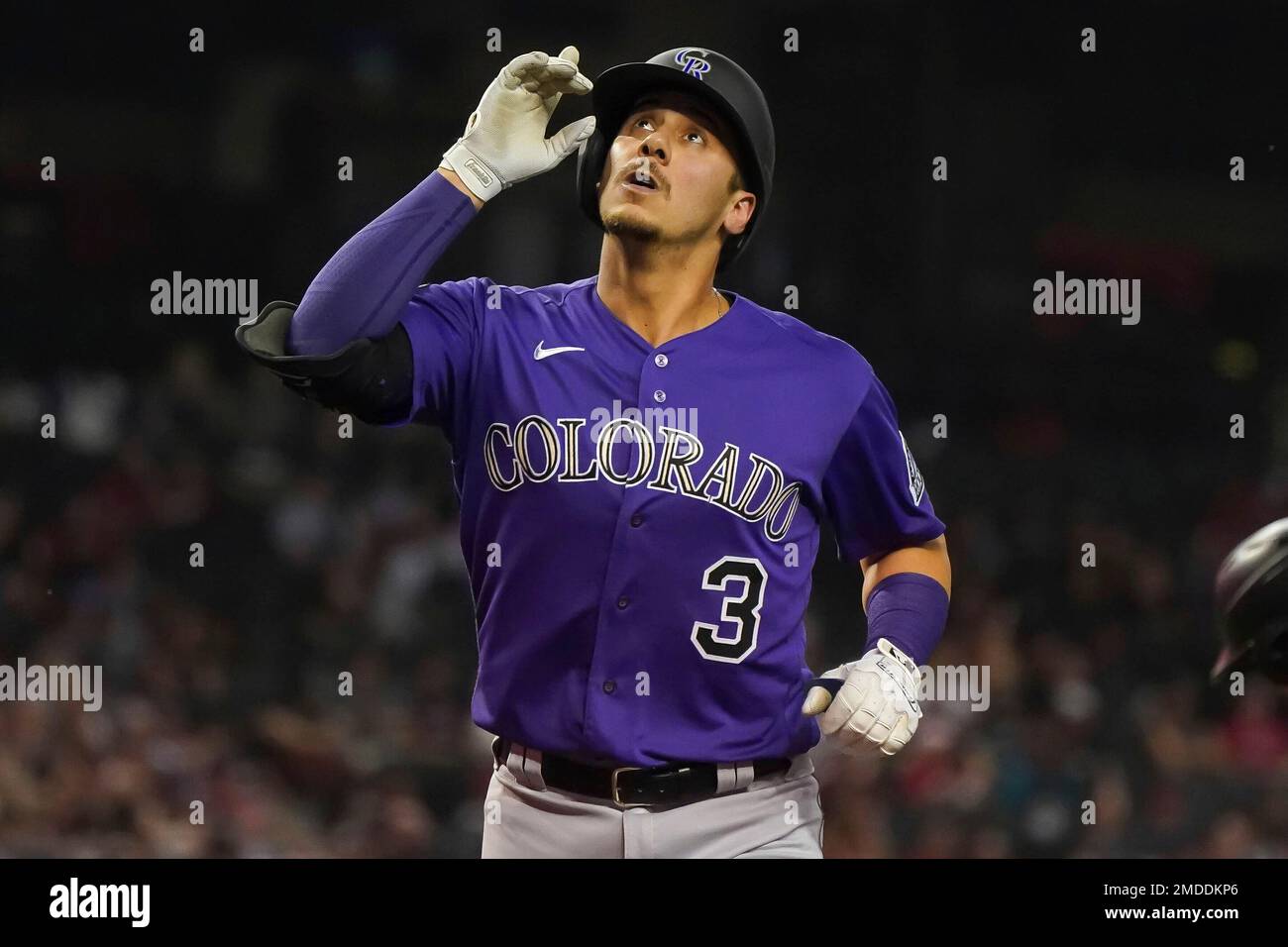 Colorado Rockies' Dom Nunez (3) points to the sky after hitting the tying  home run against the Arizona Diamondbacks' during the ninth inning of a  baseball game Friday, Oct 1, 2021, in