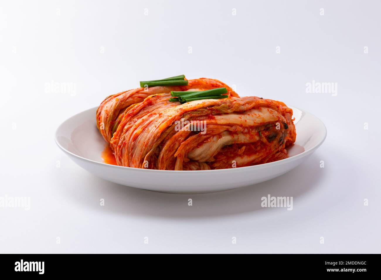 Korean kimchi. Korean traditional cabbage kimchi on white plate. White