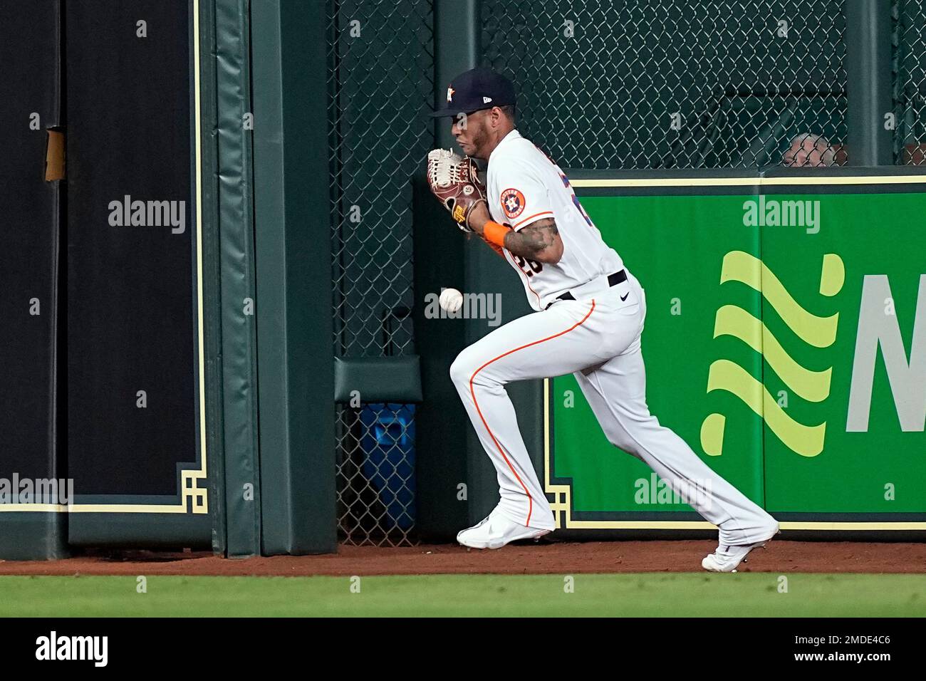 Houston Astros center fielder Jose Siri attempts to catch a fly ball by  Tampa Bay Rays' Brett Phillips during the second inning of a baseball game  Wednesday, Sept. 29, 2021, in Houston.