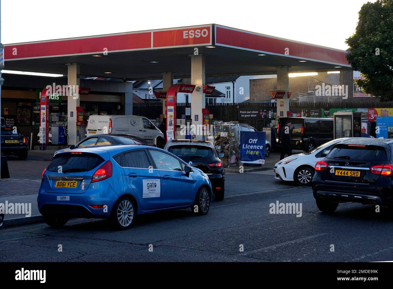 Drivers queue for fuel at a petrol station in London, Wednesday, Sept