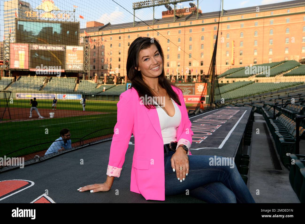 Baltimore Orioles radio and TV announcer Melanie Newman poses for a photograph before a baseball game at Oriole Park at Camden Yards, Tuesday, Sept