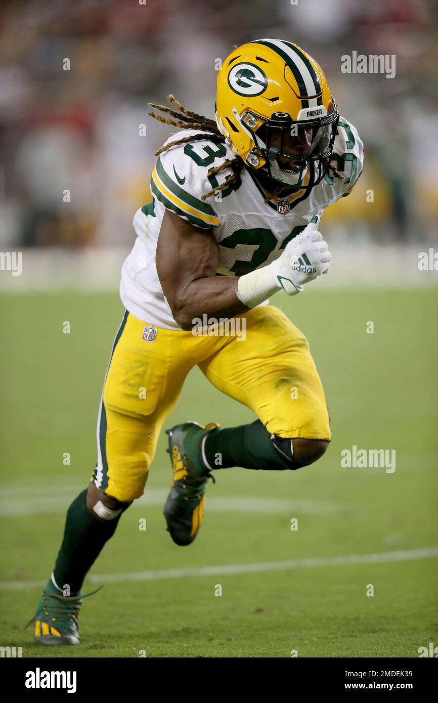 Download Green Bay Packers #33 Aaron Jones runs for a touchdown Wallpaper