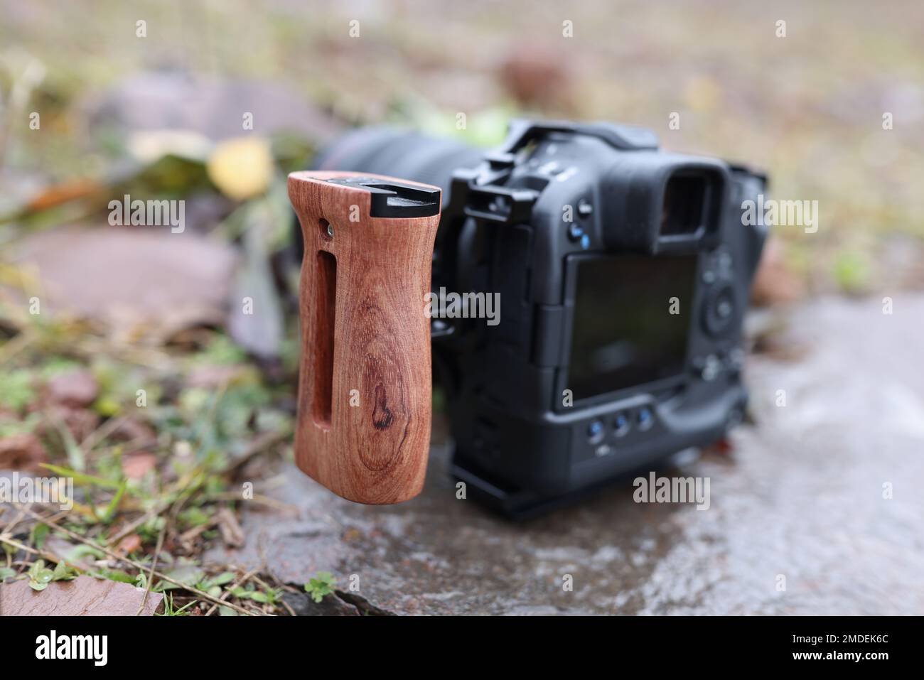 Photo camera with side handle outdoors close-up. Stock Photo