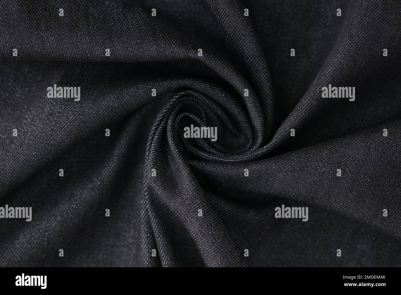 Swirled gray denim fabric as background. Stock Photo