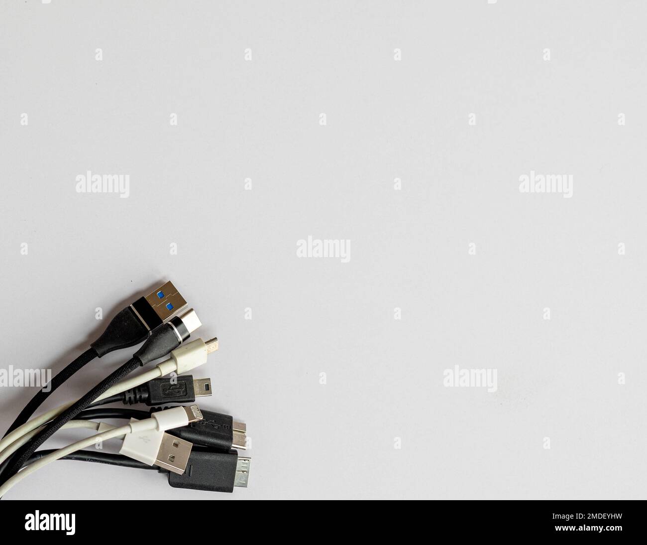 Various types of charging cable on white isolated background with copy space Stock Photo