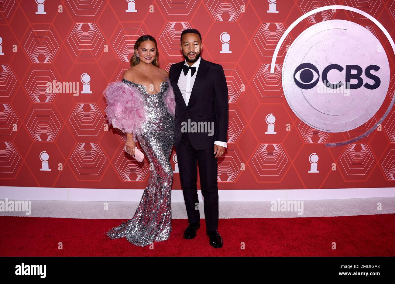 Chrissy Teigen, left, and John Legend arrive at the 74th annual Tony