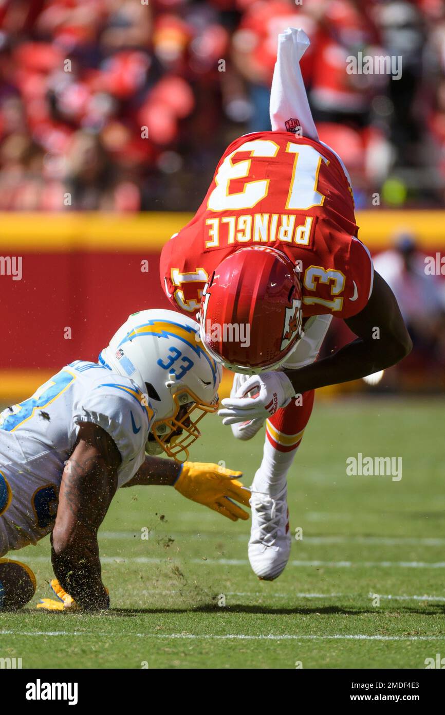 Kansas City Chiefs wide receiver Byron Pringle (13) is tackled by Los  Angeles Chargers free safety Derwin James (33) during the second half of an  NFL football game, Sunday, Sept. 26, 2021
