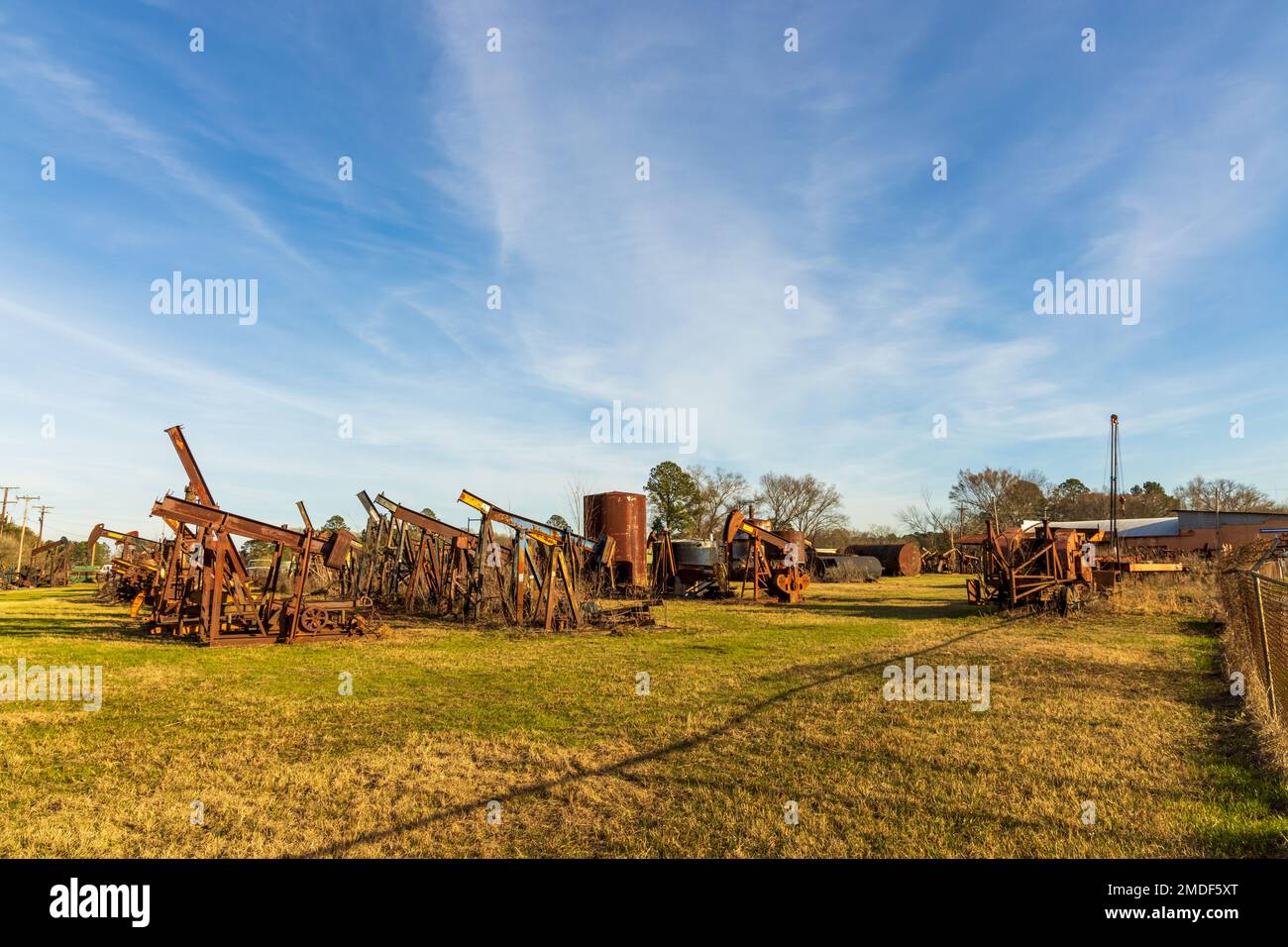 Shreveport, Louisiana - January 14, 2023: A cemetery of the old rustic pumpjacks in rural Louisiana Stock Photo