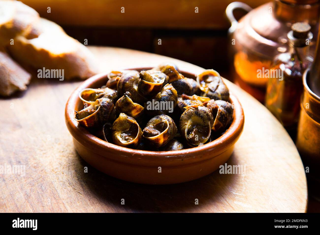 Spanish tapa of snails cooked with pepper in the oven Stock Photo Alamy