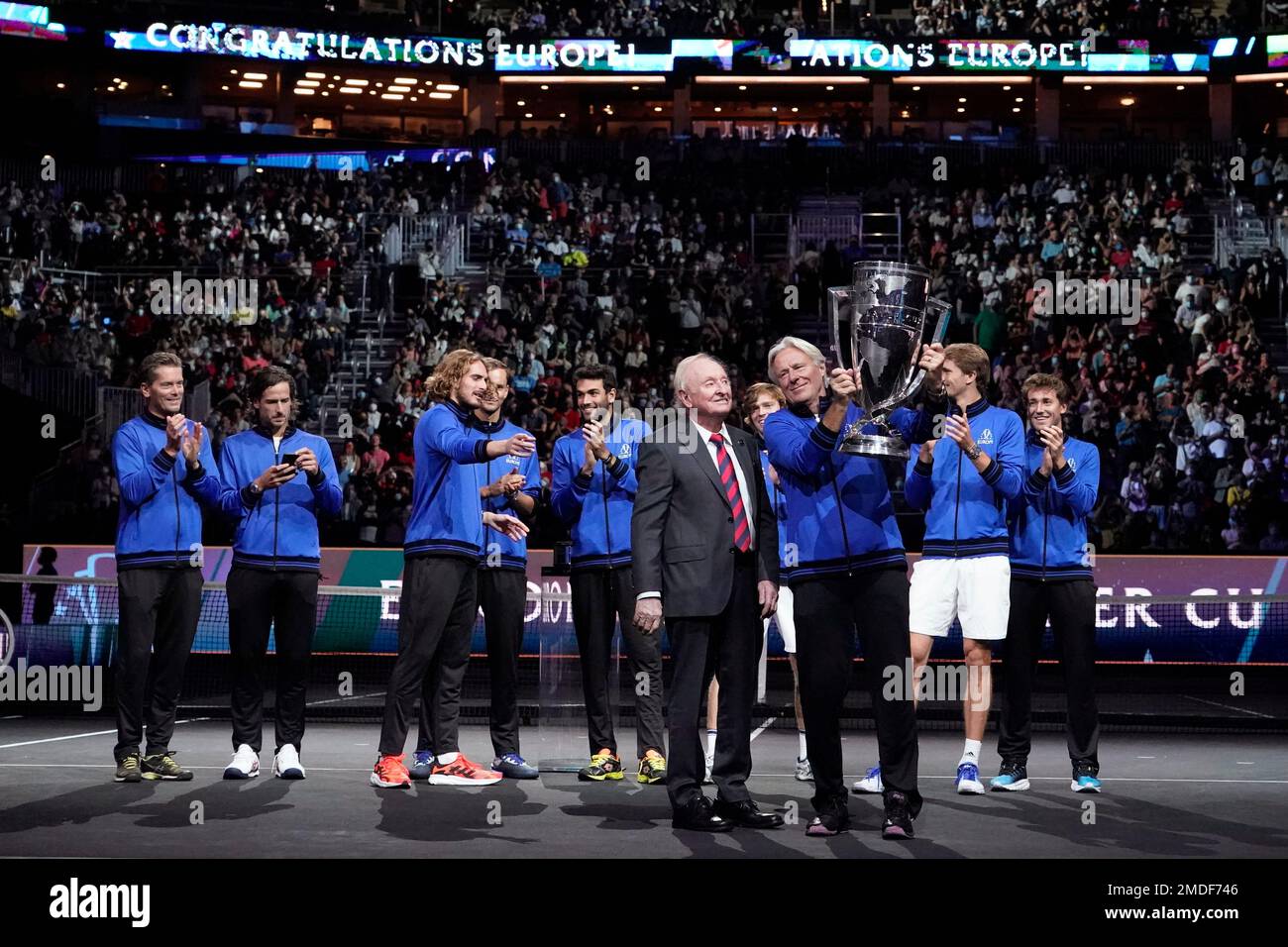 Team Europe's captain Bjorn Borg holds the Laver Cup aloft as tennis great  Rod Laver, middle, looks on after they defeated Team World for the Laver Cup,  Sunday, Sept. 26, 2021, in
