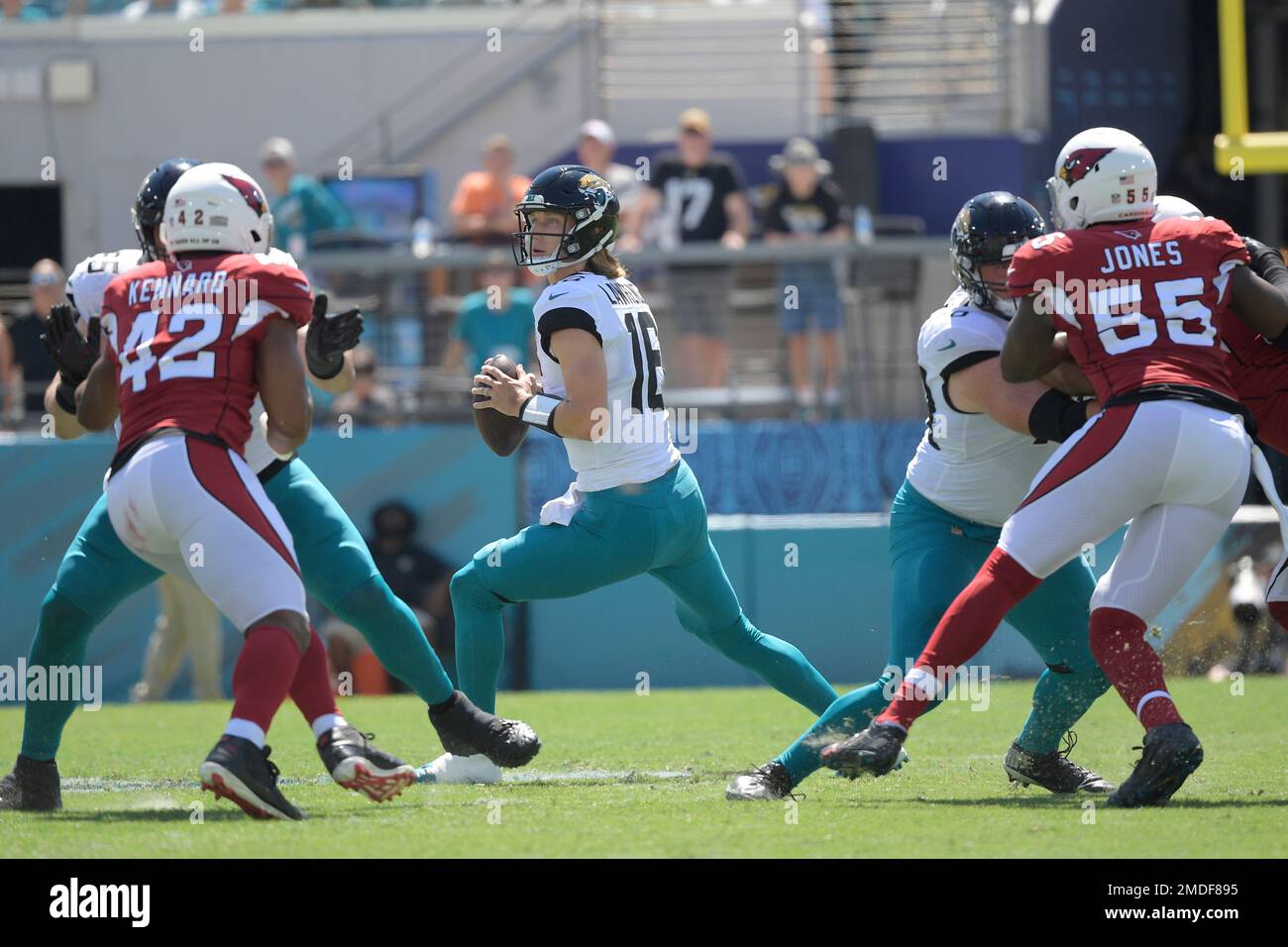 Jacksonville Jaguars quarterback Trevor Lawrence (16) looks for a receiver  during the second half of an