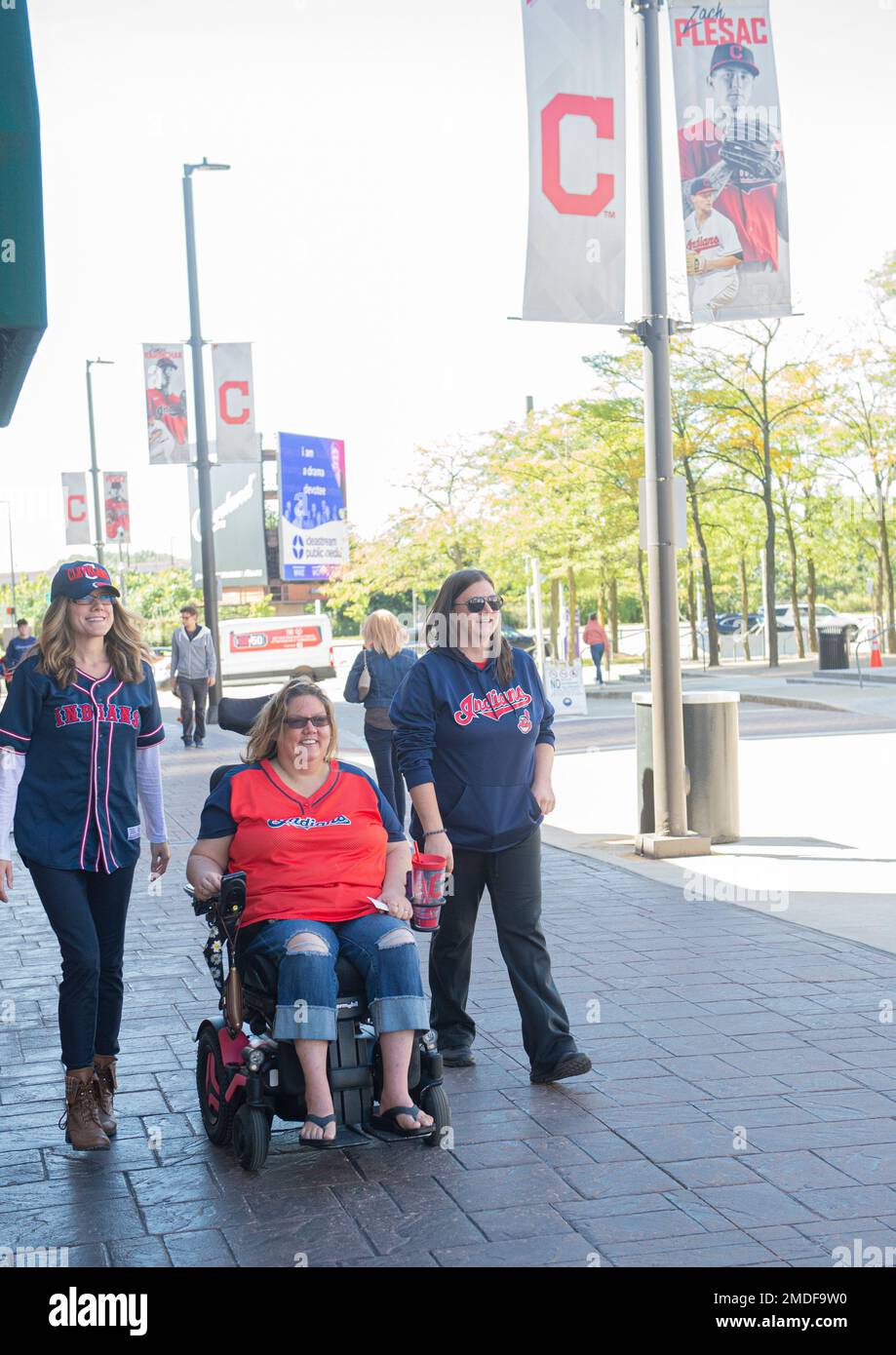 Sarah Krakora, left, of CuyahogaFalls, Ohio Gretchen Freund, of Cuyahoga  Falls and Tara Skinner of Tallmadge, Ohio wear their Indians shirts before  a baseball game between Chicago White Sox and the Cleveland