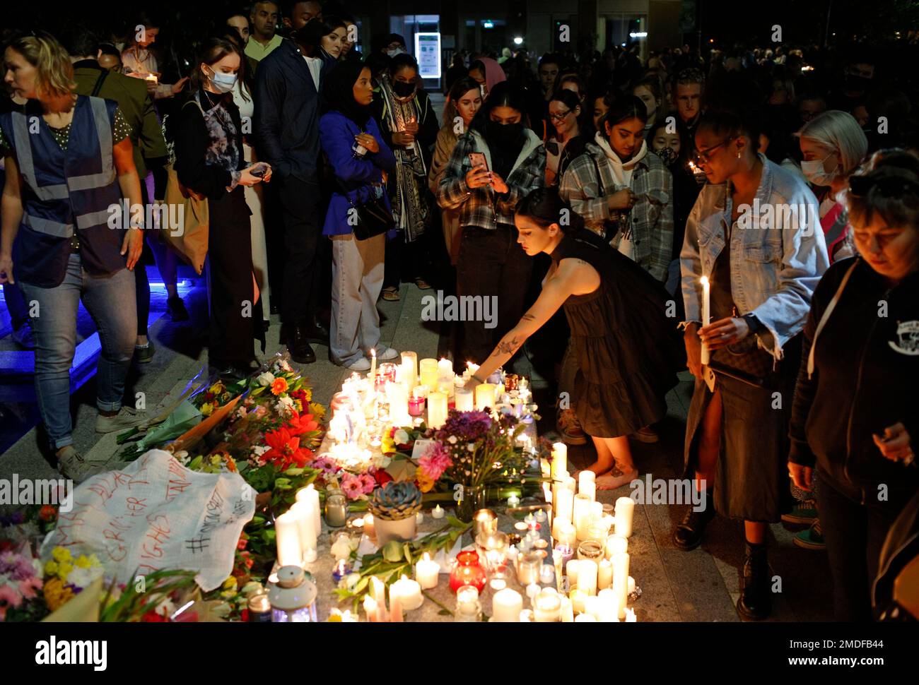 FILE In tihs , Friday, Sept. 24, 2021 file photo, people line up to