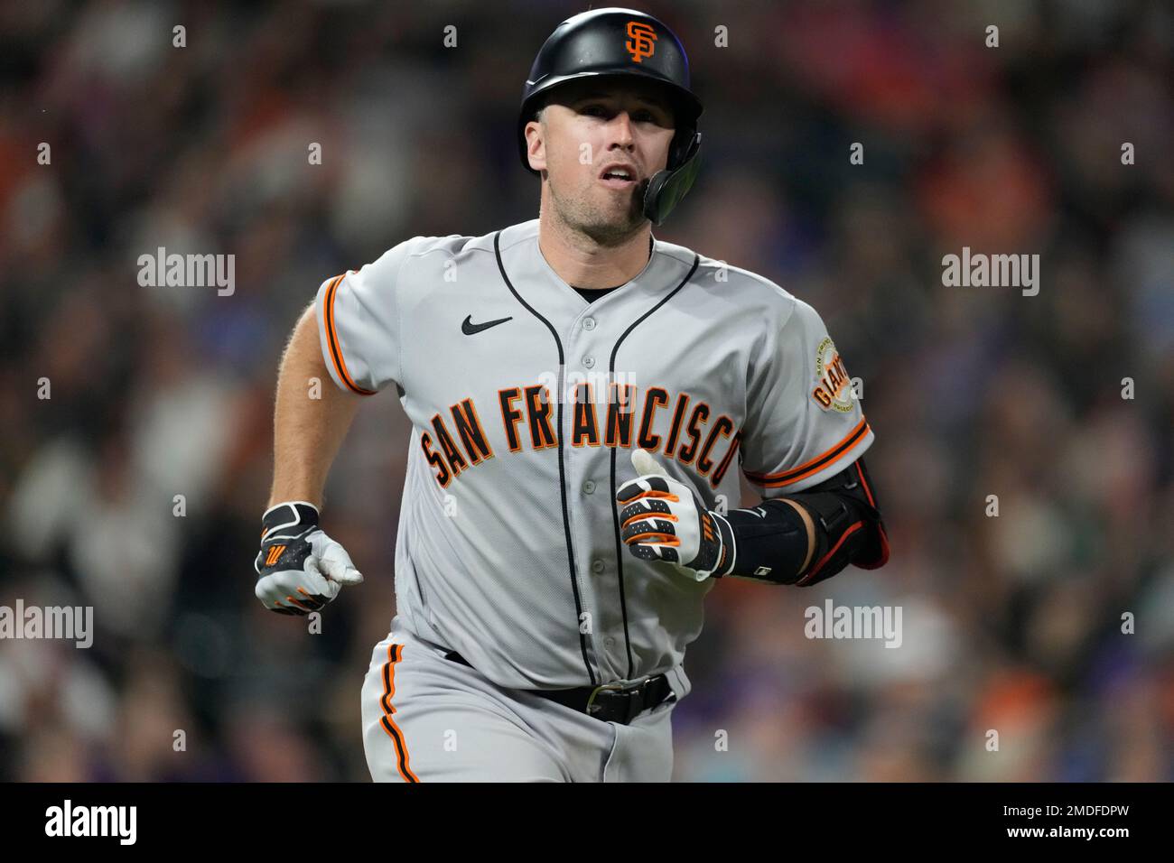 San Francisco Giants' Buster Posey heads up the first-base line after  flying out against Colorado Rockies relief pitcher Daniel Bard in the  seventh inning of a baseball game Saturday, Sept. 25, 2021
