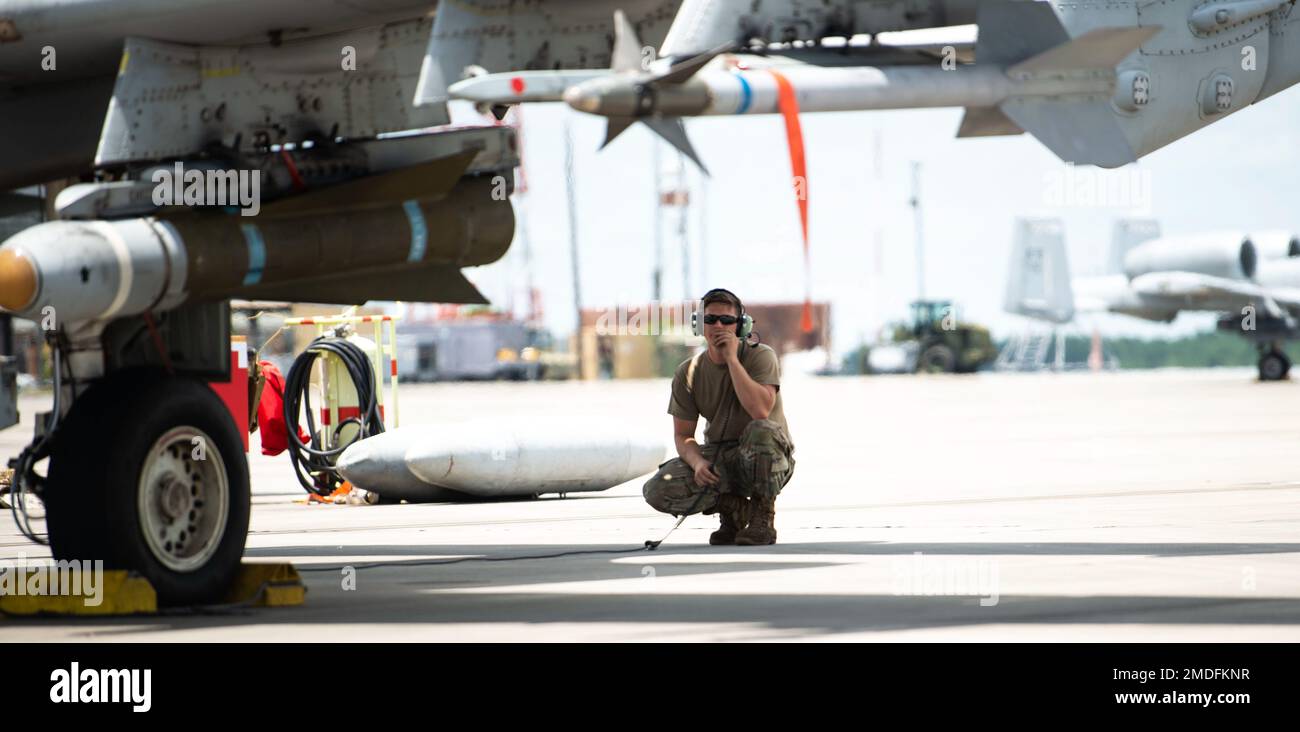 A U.S. Air Force Airman assigned to the 23rd Wing inspects an A-10C Thunderbolt II before takeoff from Savannah Air National Guard Base, Georgia, July 22, 2022. Agile Flag 22-2 is Air Combat Command's first lead-wing certification event designed to demonstrate the 23rd Wing's capability to generate combat air power while continuing to move, maneuver, and sustain the Wing and subordinate force elements in a dynamic and contested environment. Stock Photo