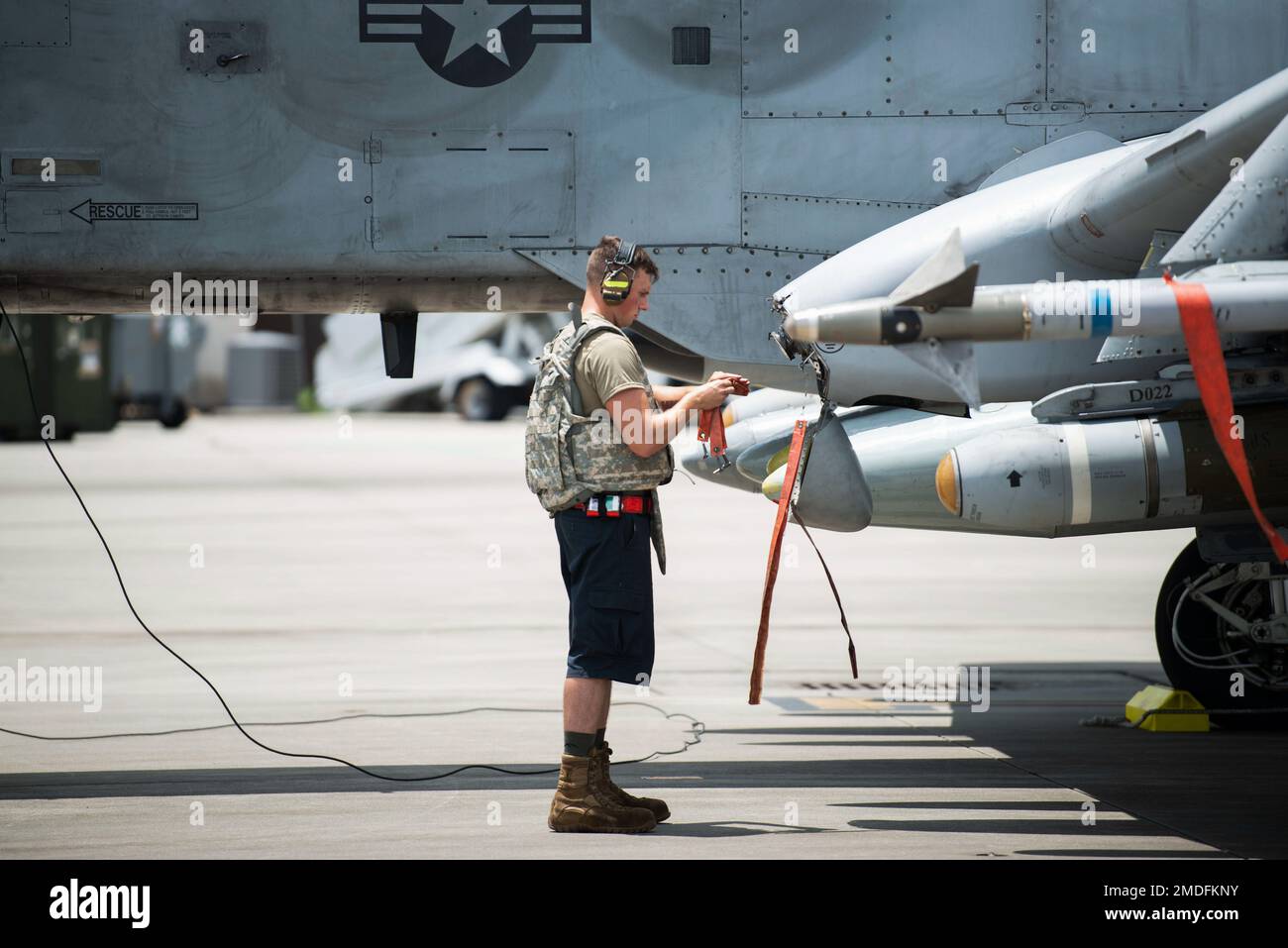 A U.S. Air Force Airman assigned to the 23rd Wing prepares an A-10C Thunderbolt II for takeoff from Savannah Air National Guard Base, Georgia, July 22, 2022. Agile Flag 22-2 is Air Combat Command's first lead-wing certification event designed to demonstrate the 23rd Wing's capability to generate combat air power while continuing to move, maneuver, and sustain the Wing and subordinate force elements in a dynamic and contested environment. Stock Photo