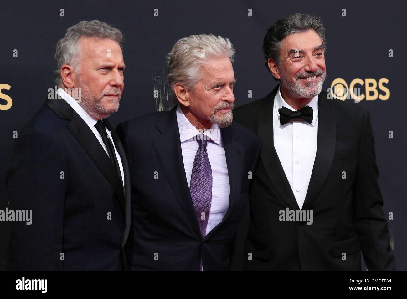 Paul Reiser, from left, Michael Douglas and Chuck Lorre arrive at the ...