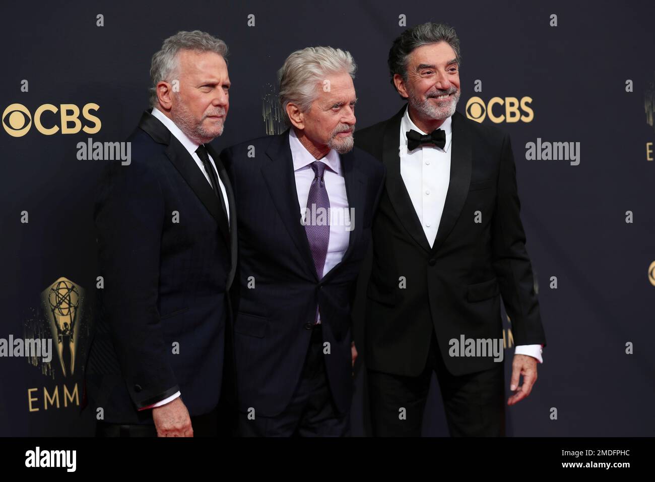 Paul Reiser, from left, Michael Douglas and Chuck Lorre arrive at the ...