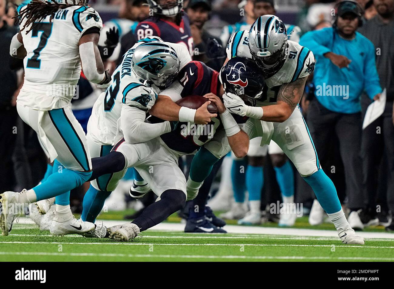 Houston Texans quarterback Davis Mills (10) is tackled by Carolina