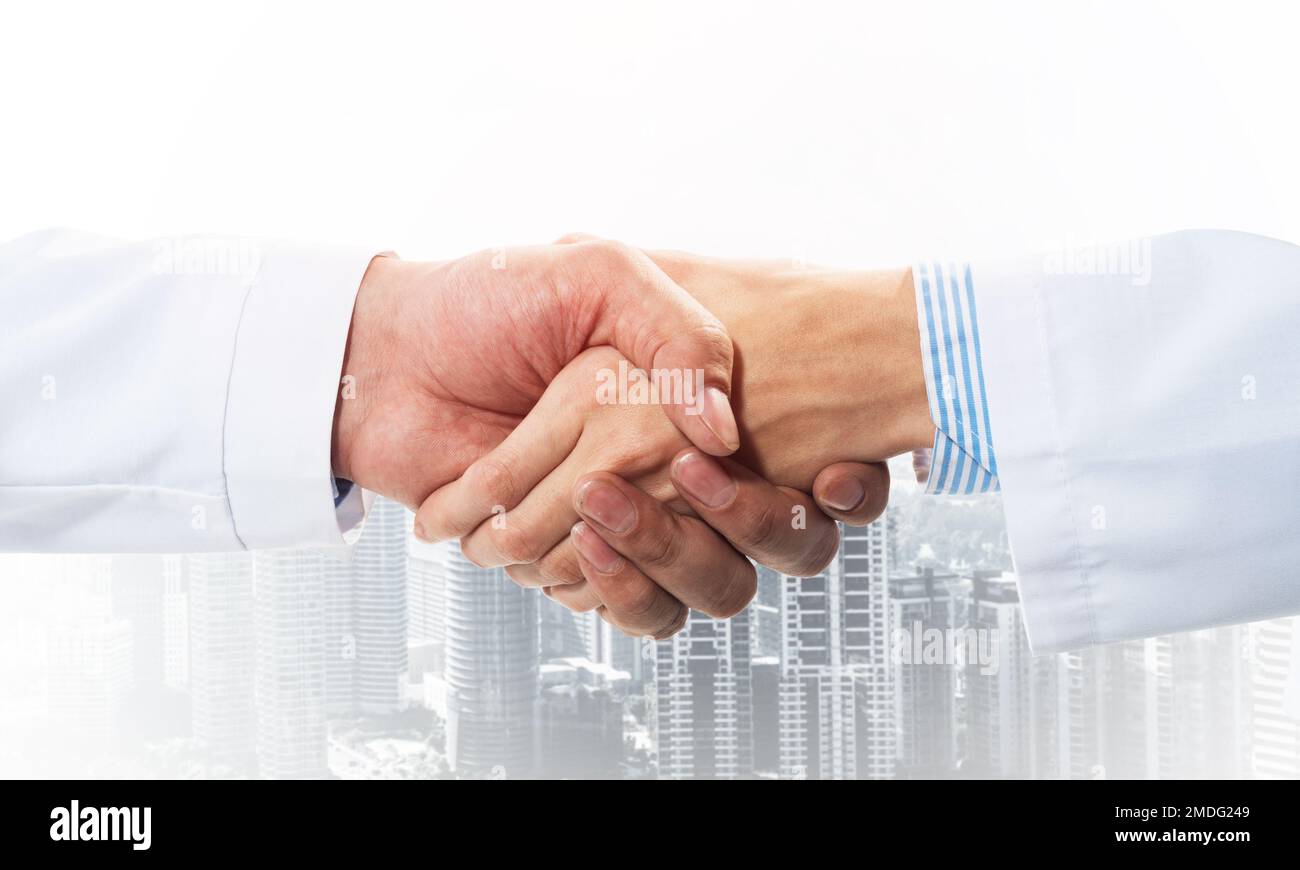 Two Doctor Handshake Handshake between nurse doctor hi-res stock photography and images - Alamy