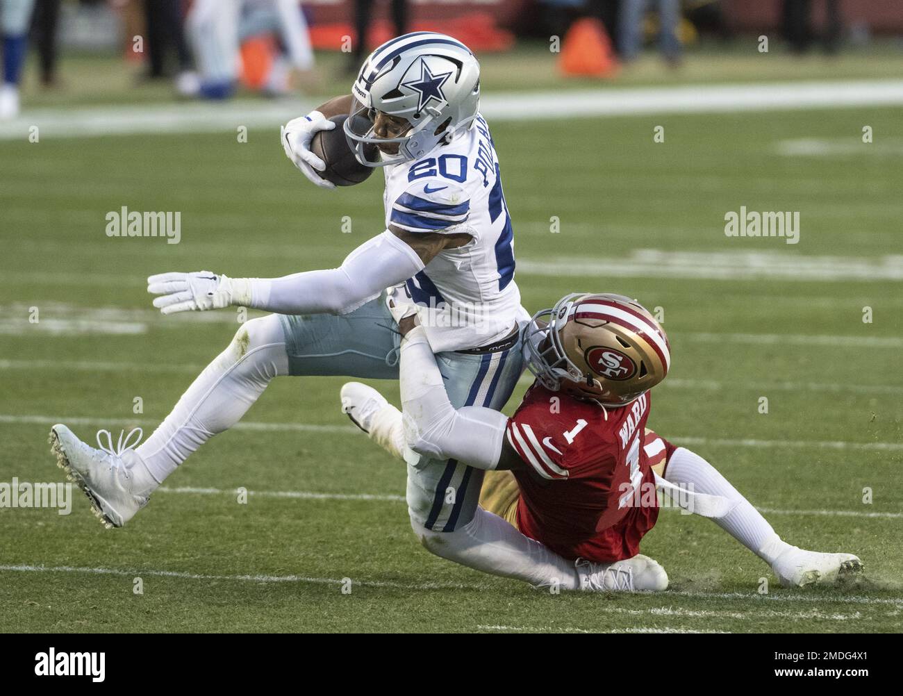 San Francisco 49ers cornerback Jimmie Ward (1) lands on the ankle of Dallas Cowboys running back