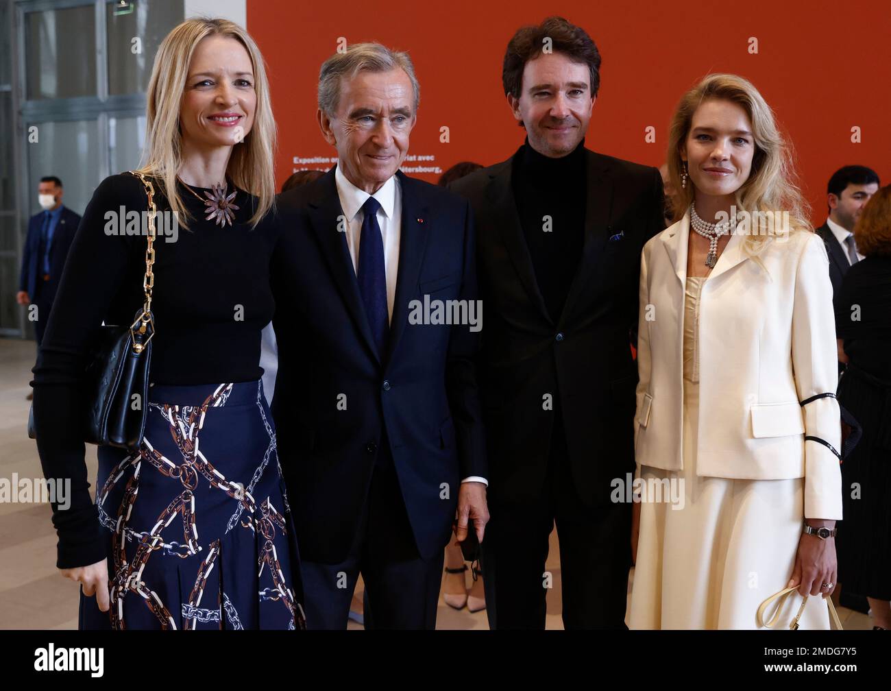LVMH luxury group CEO Bernard Arnault, center, flanked by his daughter  Delphine Arnault, left, and his son Antoine Arnault as they attend the  opening of the exhibition 'The Morozov Collection, Icons of