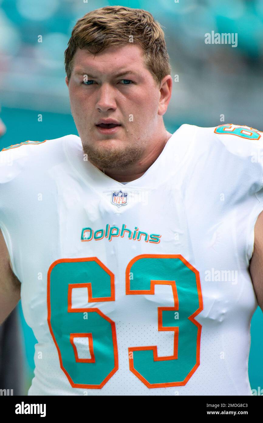 Miami Dolphins guard Michael Deiter (63) warms up on the field before an  NFL football game against the Buffalo Bills, Sunday, Sept. 19, 2021, in  Miami Gardens, Fla. (AP Photo/Doug Murray Stock