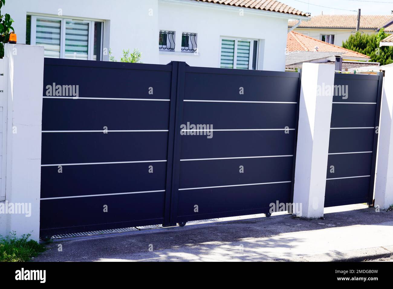 Aluminum dark gray paint metal gate house portal of suburb home door