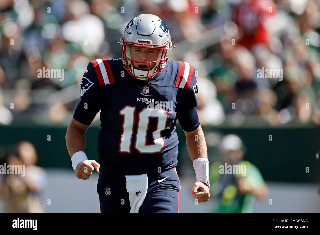 New England Patriots quarterback Mac Jones (10) reacts against the New