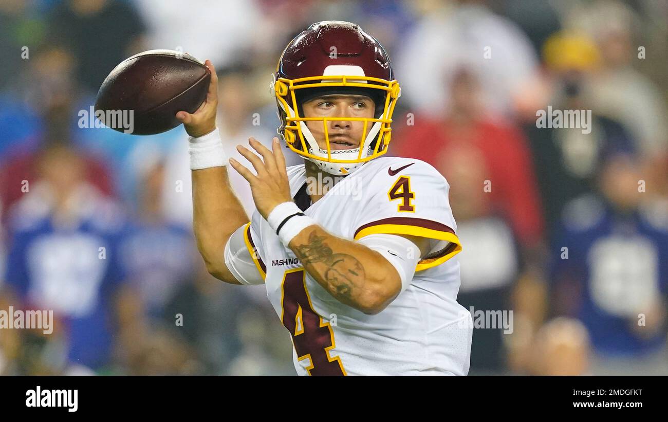 Washington Football Team quarterback Taylor Heinicke (4) warms up before an  NFL football game against the New York Giants on Sunday, Jan. 9, 2022, in  East Rutherford, N.J. (AP Photo/Adam Hunger Stock