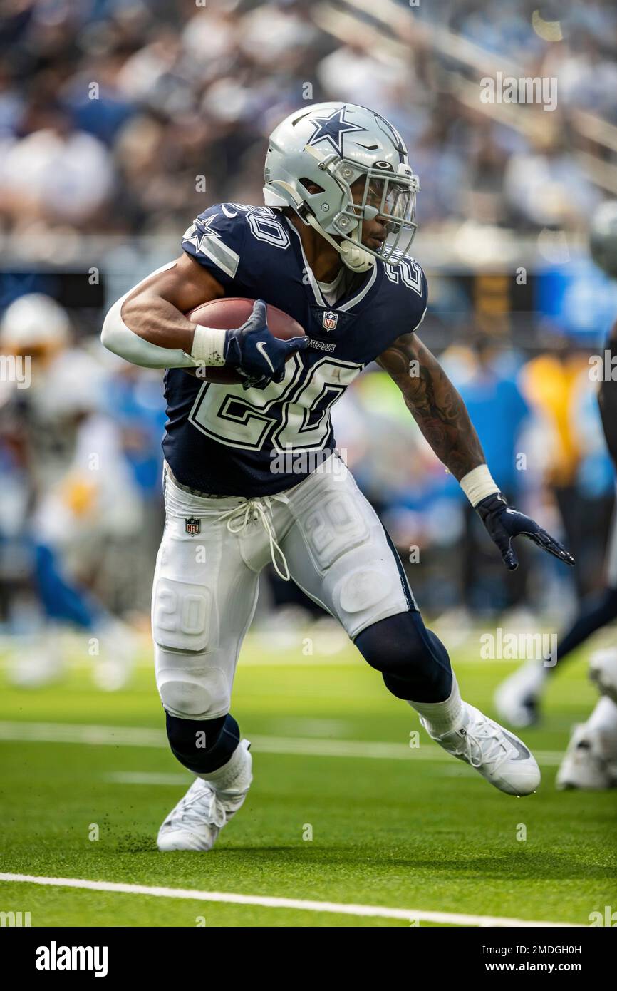 Running back (20) Tony Pollard of the Dallas Cowboys runs and scores a  touchdown against the Los Angeles Chargers in an NFL football game, Sunday,  Sept. 19, 2021, in Inglewood, Calif. The