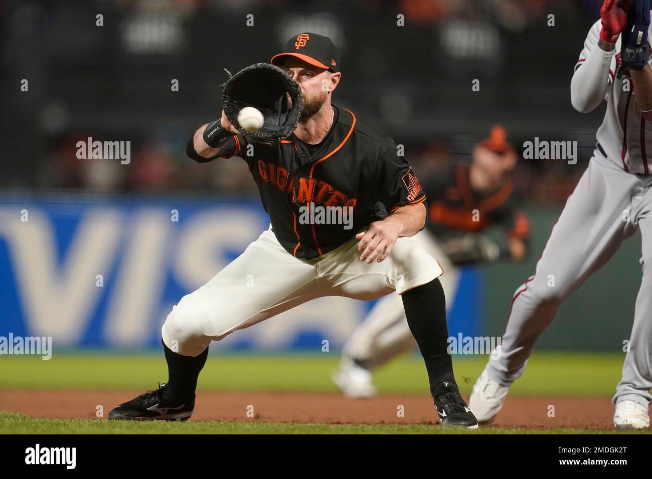 San Francisco, United States. 19th Sep, 2021. San Francisco Giants Brandon  Belt wears a captain's cap in the dugout before a game against the Atlanta  Braves at Oracle Park on Sunday, September