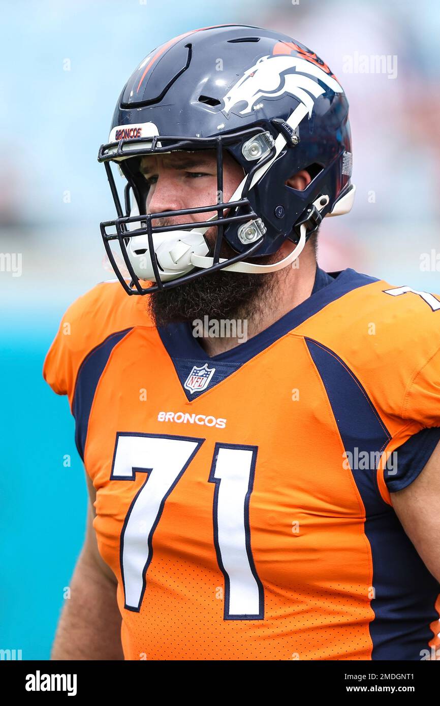 Denver Broncos offensive guard Austin Schlottmann (71) takes part in drills  during an NFL football training camp Friday, Aug. 6, 2021, at the team's  headquarters in Englewood, Colo. (AP Photo/David Zalubowski Stock