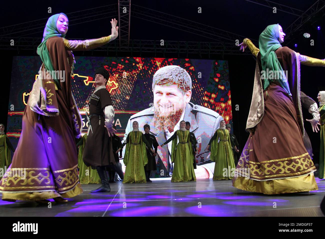 Dancers wearing Chechen national costumes perform celebrating the re ...