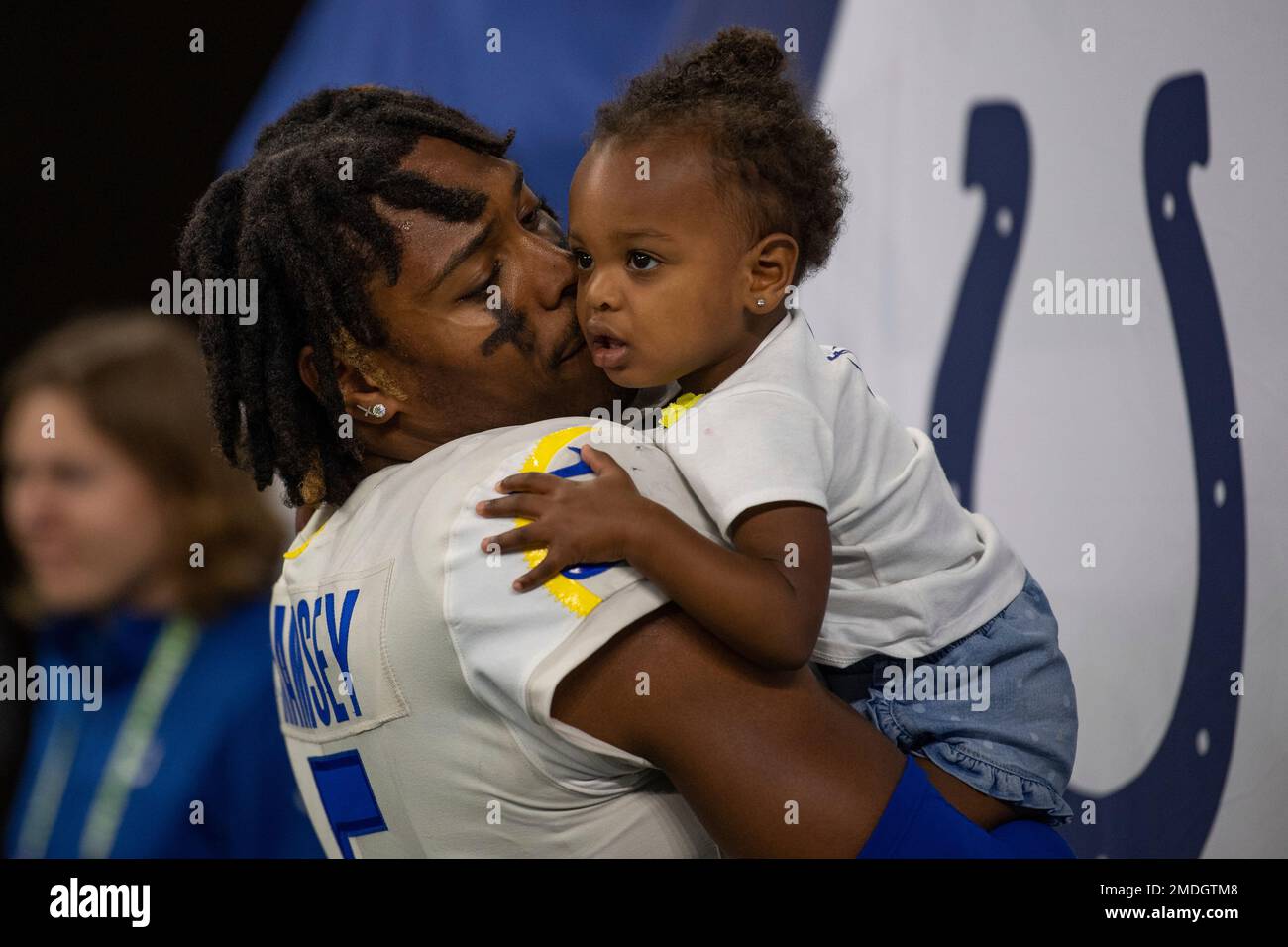 Los Angeles Rams' Jalen Ramsey (5) holds his daughter as he leaves the  field following an NFL football game against the Indianapolis Colts,  Sunday, Sept. 19, 2021, in Indianapolis. (AP Photo/Michael Conroy