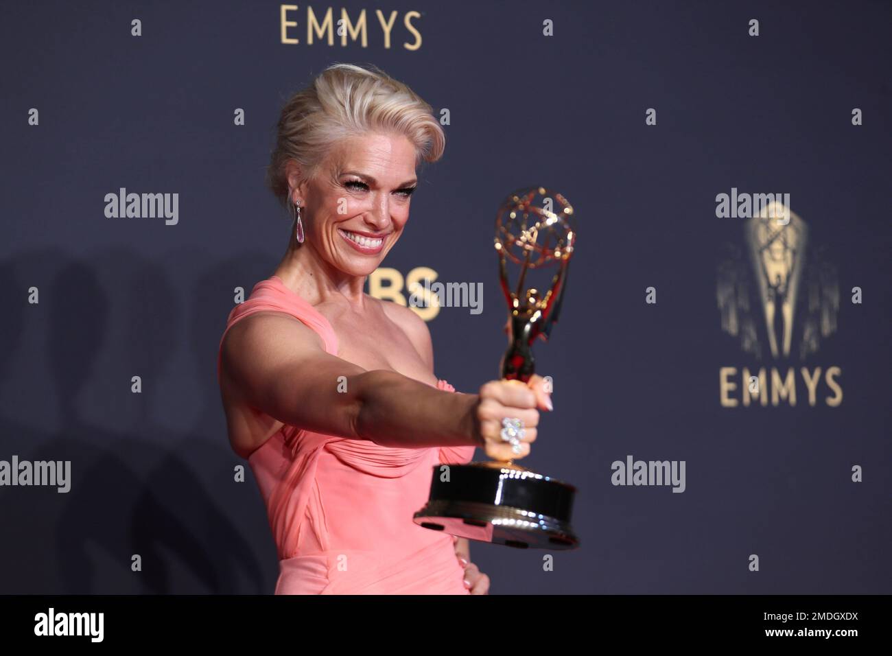 Hannah Waddingham poses for a photo with the award for outstanding